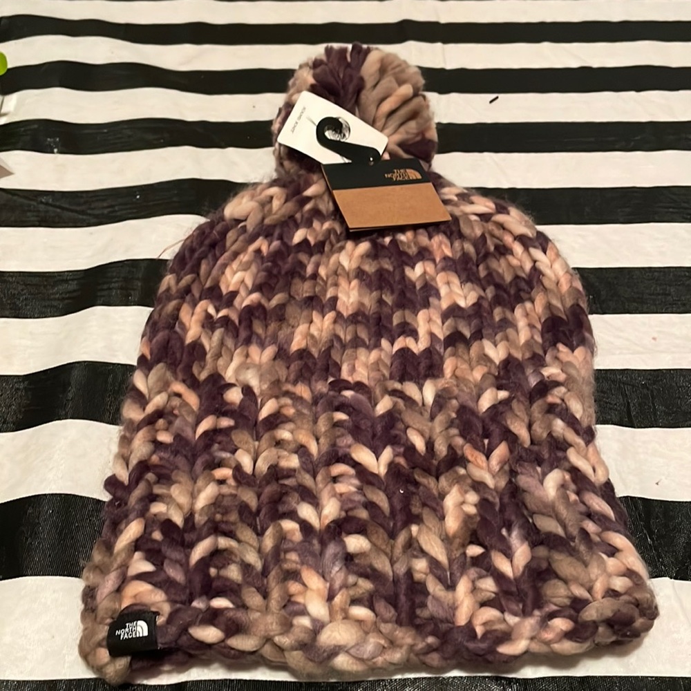 Two brand new the North Face hand knit one size fits all hats.